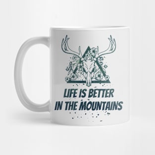 LIFE IS BETTER IN THE MOUNTAINS Dead Deer Skull Triangle With Flowers With Dark Green Forest Colors Mug